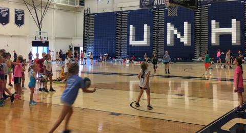 Girl driving to basket at UNH Basketball Camp